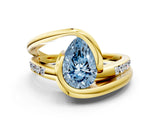 Yellow gold Fancy Blue Pear Cut Solitaire Tension-Set Diamond Split Shank Ring