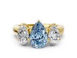 Yellow gold Fancy Blue Pear Cut Three-Stone Diamond Ring with Prong Setting on a Classic Band_12