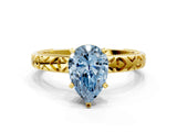 Yellow gold Fancy Blue Pear  Solitaire Diamond Engagement Ring with XO Engraved Band and Four-Prong Setting 1