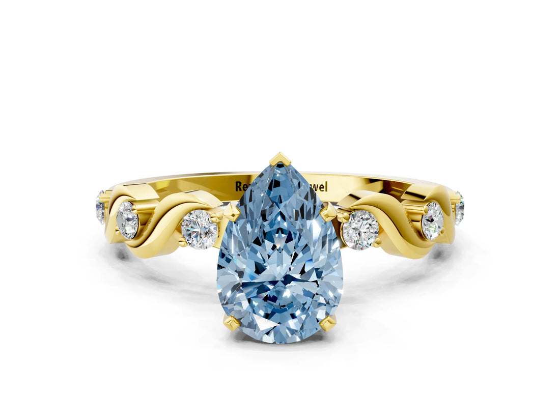 Yellow gold Fancy Blue Pear  Solitaire Twisted Band with Prong Setting