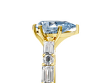 Yellow gold Fancy Blue Pear  Solitaire with Side Baguettes and Channel Set Band_64