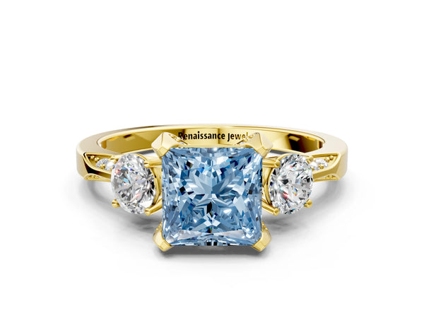 Yellow gold Fancy Blue Princess Cut Brilliant Three-Stone Diamond Ring with Pavé Band and Four-Prong Setting