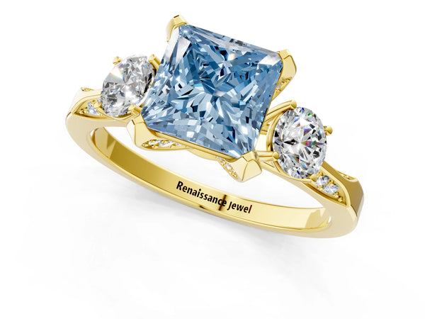 Yellow gold Fancy Blue Princess Cut Brilliant Three-Stone Diamond Ring with Pavé Band and Four-Prong Setting
