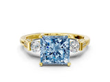 Yellow gold Fancy Blue Princess Cut Brilliant Three-Stone Pave Band with Four-Prong Setting