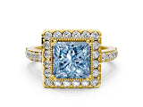 Yellow gold Fancy Blue Princess Cut Diamond Halo Ring with Pavé Band and Prong Setting