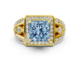 Yellow gold Fancy Blue Princess Cut Diamond Halo Ring with Split Shank and Bezel Accents and Four-Prong Setting