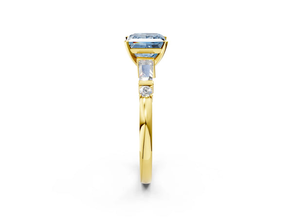 Yellow gold Fancy Blue Princess  Cut Diamond Ring with Baguette Side Stones, Channel Set Band, and Four-Prong Setting