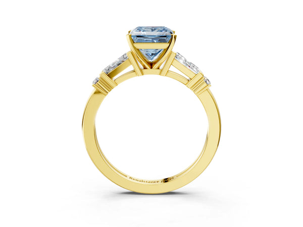 Yellow gold Fancy Blue Princess  Cut Diamond Ring with Baguette Side Stones, Channel Set Band, and Four-Prong Setting