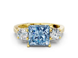 Yellow gold Fancy Blue Princess Cut Diamond Three-Stone Engagement Ring with Prong Setting and Pavé Band