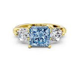 Yellow gold Fancy Blue Princess Cut Diamond Three-Stone Ring with Prong Setting and Pavé Band