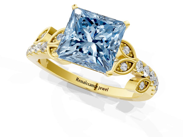 Yellow gold Fancy Blue Princess Cut Solitaire Leaf-Inspired Diamond Ring with Pavé Band and Four-Prong Setting