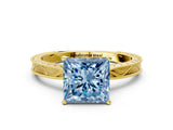 Yellow gold Fancy Blue Princess Cut Solitaire Milgrain Engraved Band with Four-Prong Setting