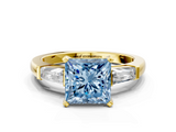 Yellow gold Fancy Blue Princess  Solitaire with Tapered Baguette Side Stones on a Classic Band with Four-Prong Setting_100