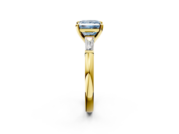 Yellow gold Fancy Blue Princess  Solitaire with Tapered Baguette Side Stones on a Classic Band with Four-Prong Setting