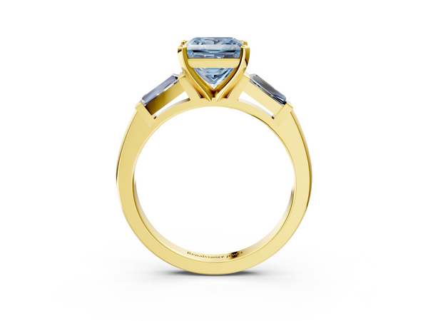 Yellow gold Fancy Blue Princess  Solitaire with Tapered Baguette Side Stones on a Classic Band with Four-Prong Setting