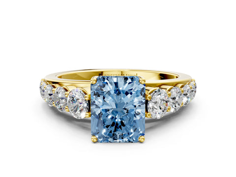 Yellow gold Fancy Blue Radiant Cut Brilliant Diamond Pavé Band with Six-Prong Setting