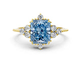 Yellow gold Fancy Blue Radiant Cut Brilliant Diamond with Cluster Setting on a Beaded Band and Four-Prong Setting