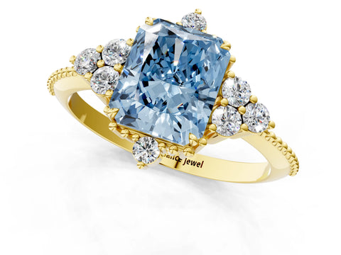 Yellow gold Fancy Blue Radiant Cut Brilliant Diamond with Cluster Setting on a Beaded Band and Four-Prong Setting_1