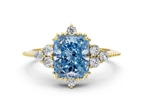 Yellow gold Fancy Blue Radiant Cut Brilliant Diamond with Cluster Setting on a Beaded Band and Four-Prong Setting
