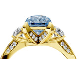 Yellow gold Fancy Blue Radiant Cut Brilliant Three-Stone Diamond Ring with Pavé Band and Four-Prong Setting_7