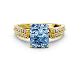 Yellow gold Fancy Blue Radiant Cut Cut Pave Split Shank Engagement Ring with Four-Prong Setting