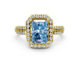 Yellow gold Fancy Blue Radiant Cut Diamond Double Halo Ring with Split Shank and Four-Prong Setting