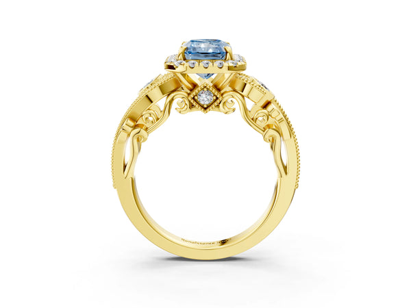 Yellow gold Fancy Blue Radiant Cut Diamond Halo Ring with Milgrain Pavé Band and Four-Prong Setting