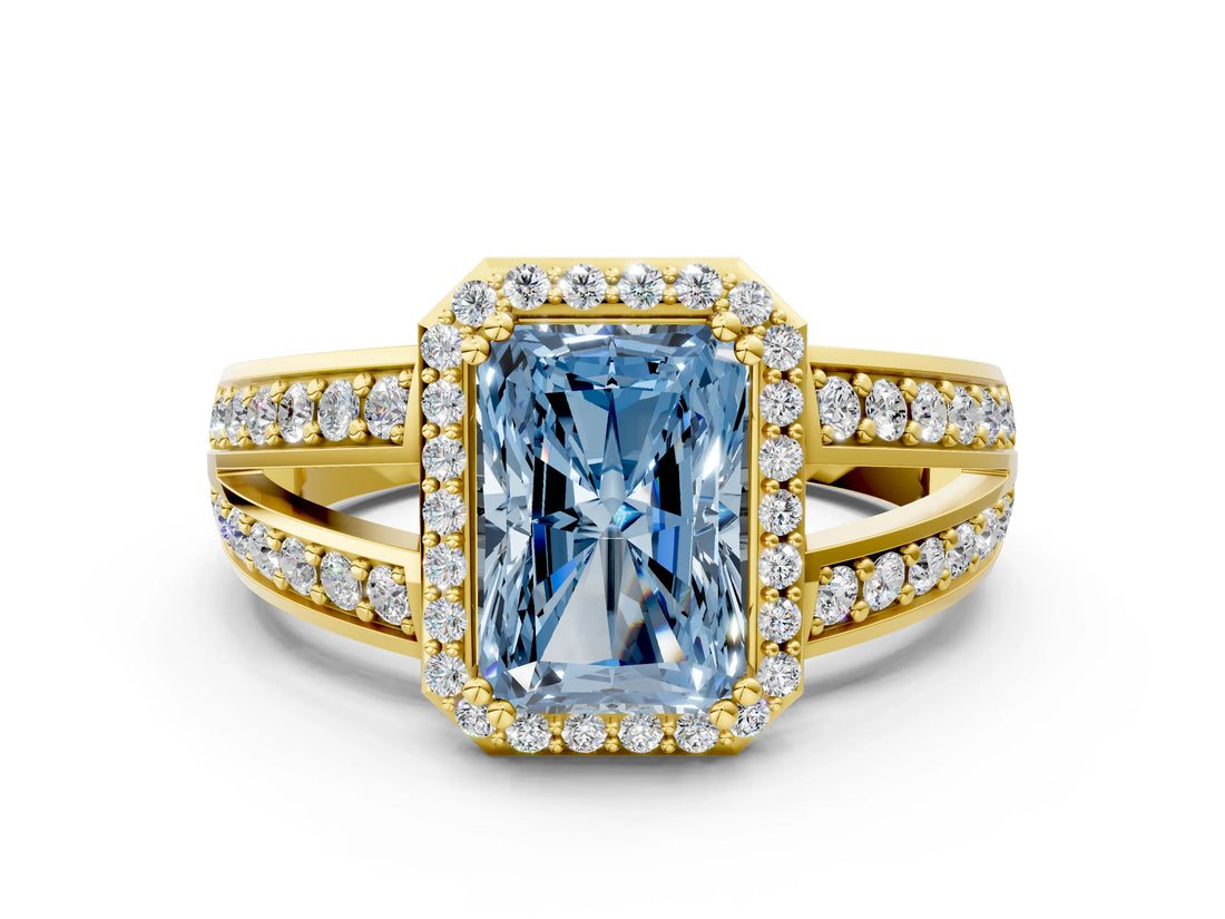 Yellow gold Fancy Blue Radiant Cut Diamond Halo Ring with Split Shank Pavé Band and Four-Prong Setting