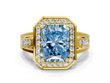 Yellow gold Fancy Blue Radiant Cut Diamond Halo Ring with Split Shank and Bezel Accents and Prong Setting