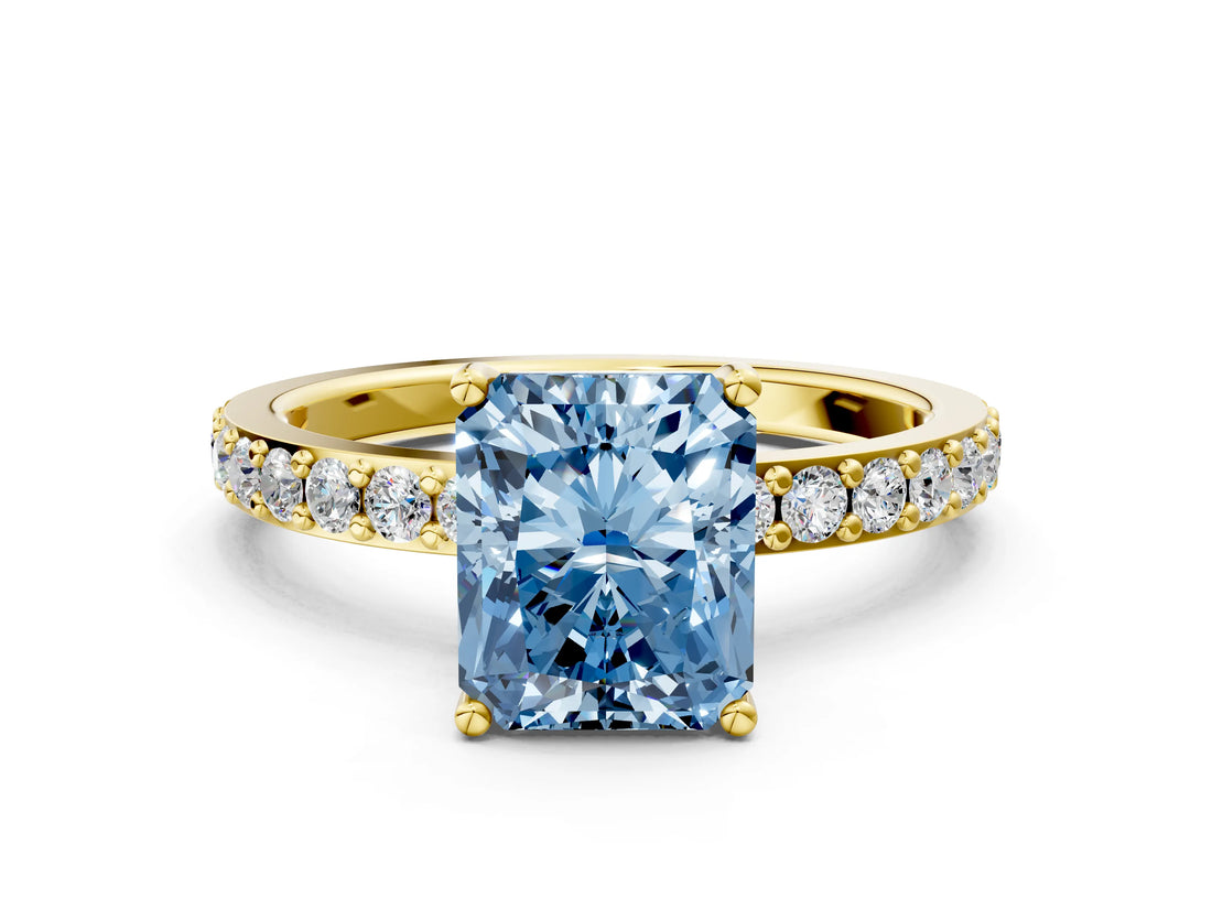 Yellow gold Fancy Blue Radiant  Cut Diamond Solitaire with Pave Band and Four-Prong Setting