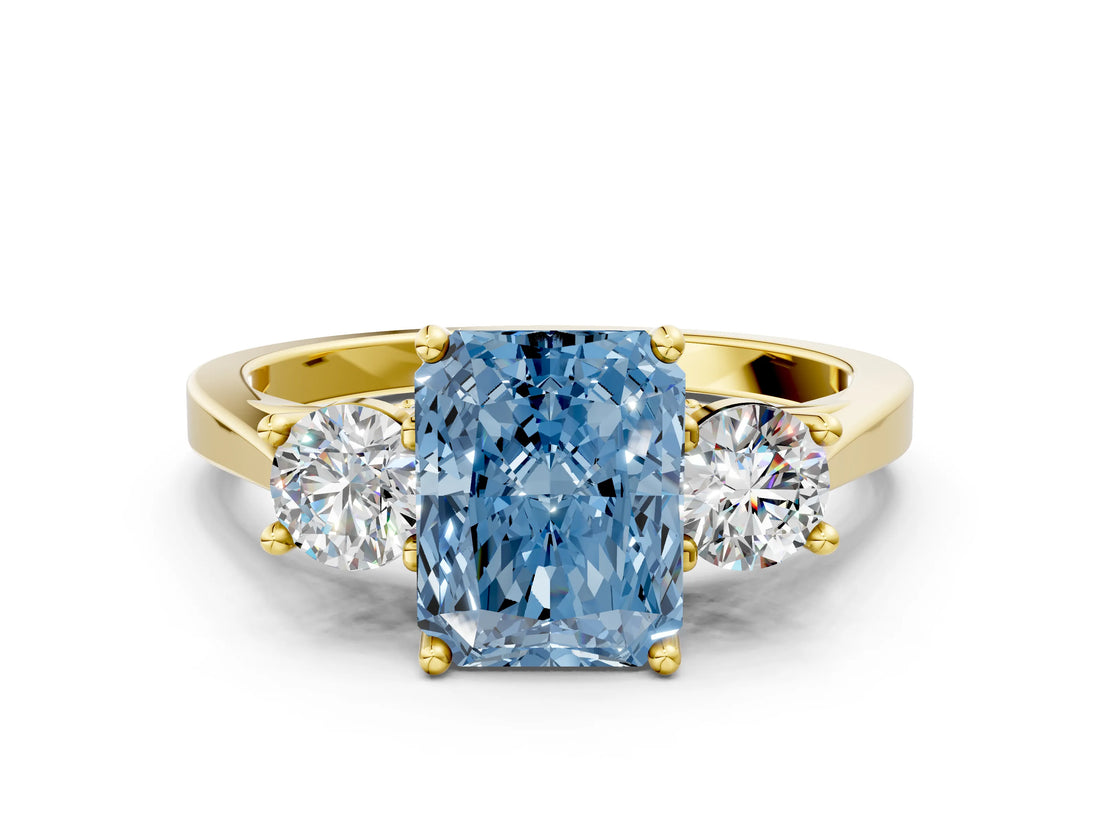 Yellow gold Fancy Blue Radiant Cut Diamond Three-Stone Engagement Ring with Prong Setting and Pavé Band