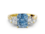 Yellow gold Fancy Blue Radiant Cut Diamond Three-Stone Engagement Ring with Prong Setting and Pavé Band