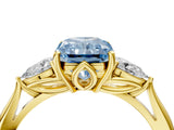 Yellow gold Fancy Blue Radiant Cut Diamond Three-Stone Ring with Pear Side Stones and Four-Prong Setting_63