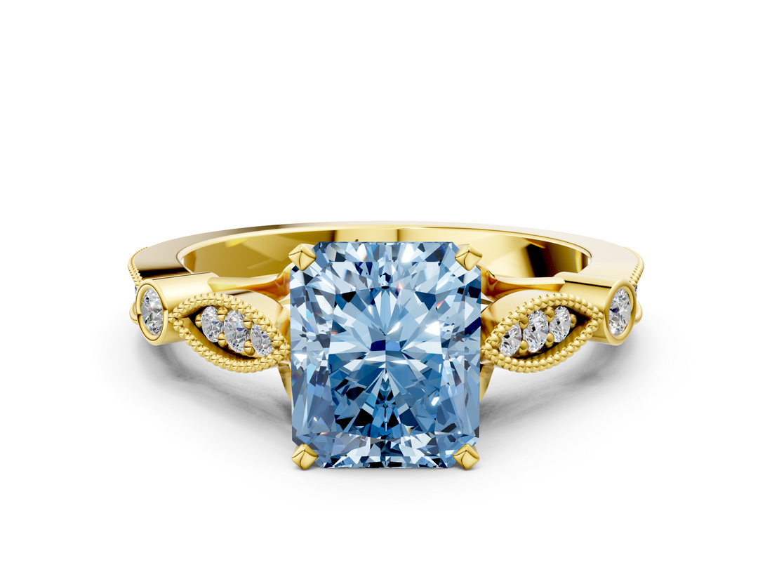Yellow gold Fancy Blue Radiant  Cut Diamond with Milgrain Marquise and Bezel Accents on a Solitaire Band with Prong Setting_213