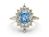 Yellow gold Fancy Blue Radiant Cut Halo Diamond Cluster Ring with Marquise and Round Stones on a White Gold Band with Prong Setting