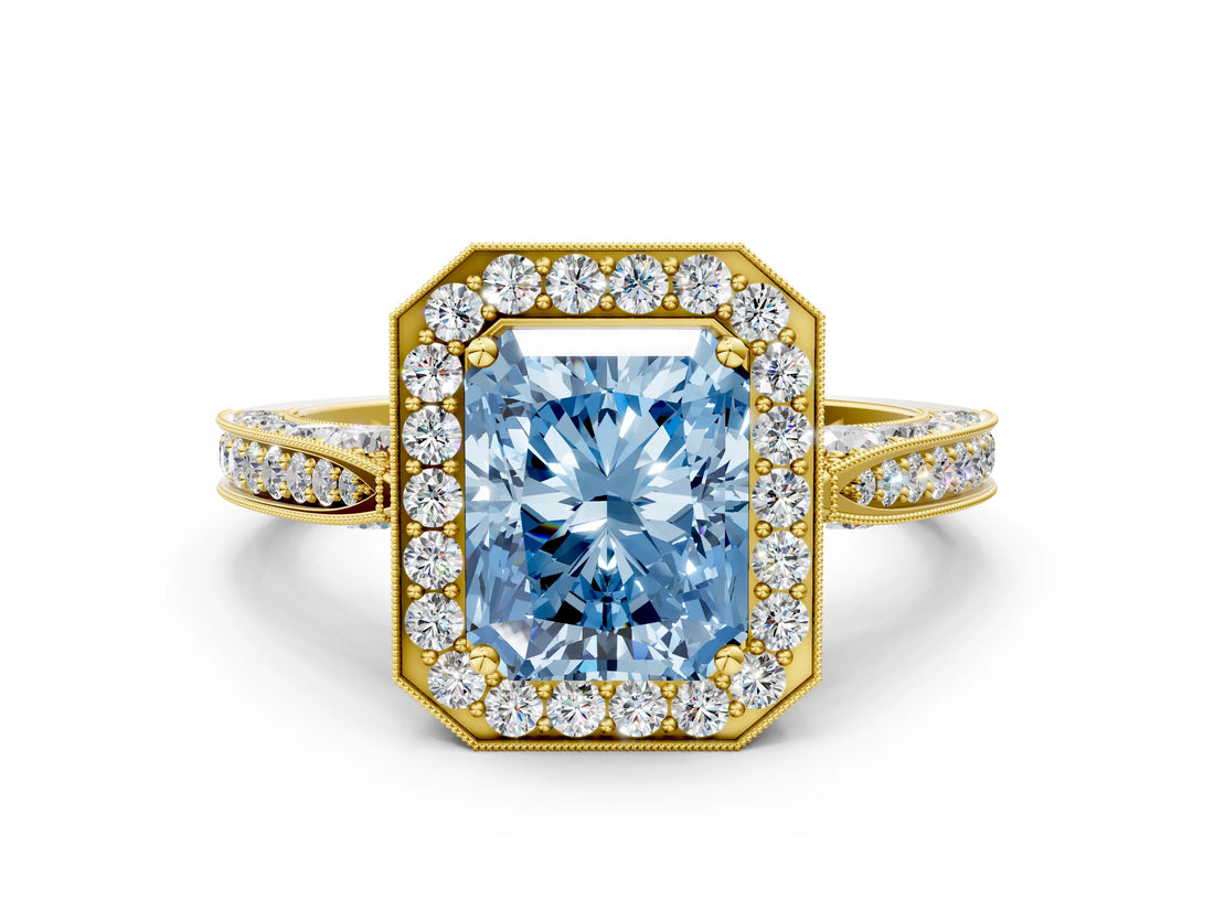Yellow gold Fancy Blue Radiant Cut Halo Diamond Engagement Ring with Split Shank Band and Four-Prong Setting