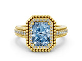Yellow gold Fancy Blue Radiant Cut Halo Diamond Ring with Beaded Split Shank and Four-Prong Setting