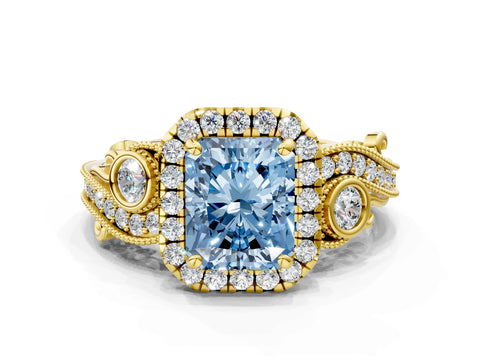 Yellow gold Fancy Blue Radiant Cut Halo Diamond Ring with Milgrain and Bezel Accents on a Split Shank Band