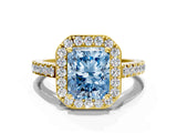 Yellow gold Fancy Blue Radiant Cut Halo Diamond Ring with Pavé Band and Three-Prong Setting
