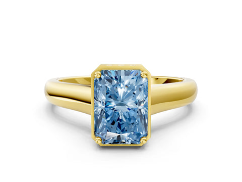 Yellow gold Fancy Blue Radiant Cut Solitaire Diamond Engagement Ring with Four-Prong Setting and Tapered Band
