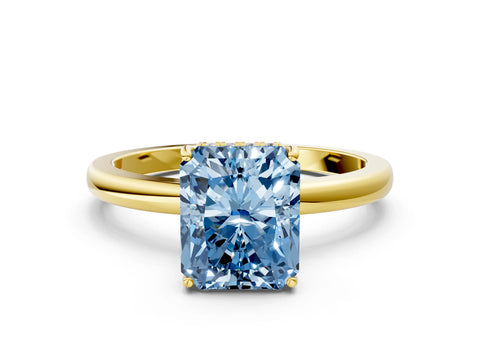Yellow gold Fancy Blue Radiant Cut Solitaire Diamond Ring with Prong Setting and Plain Band