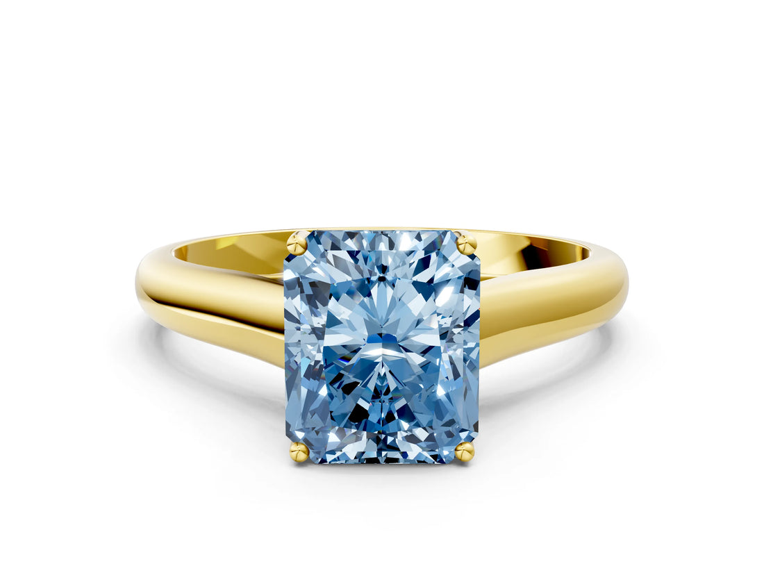 Yellow gold Fancy Blue Radiant Cut Solitaire Engagement Ring with Tapered Band and Four-Prong Setting_3