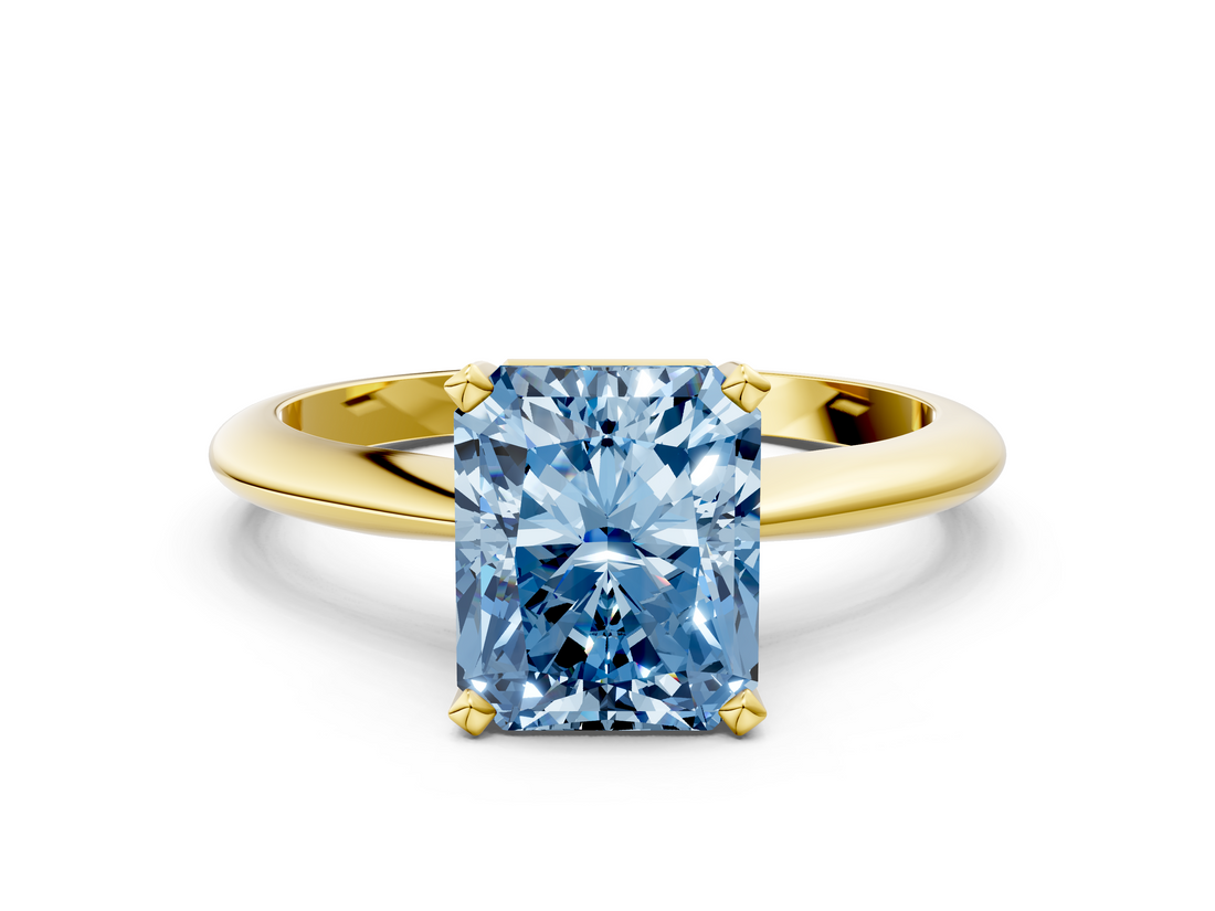 Yellow gold Fancy Blue Radiant  Cut Solitaire Ring with Four-Prong Setting on a Classic Band_25