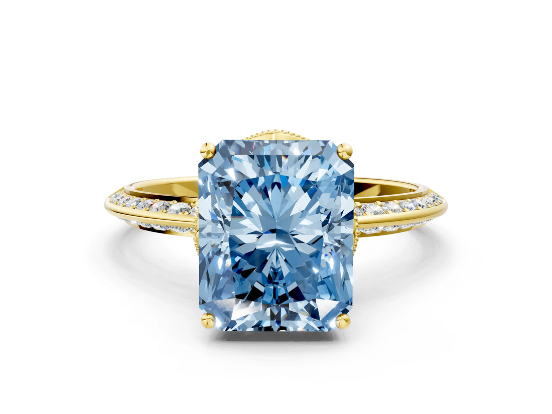 Yellow gold Fancy Blue Radiant Cut Solitaire Split Shank Pave Diamond Engagement Ring with Four-Prong Setting