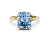 Yellow gold Fancy Blue Radiant Cut Solitaire Split Shank Pave Diamond Engagement Ring with Four-Prong Setting
