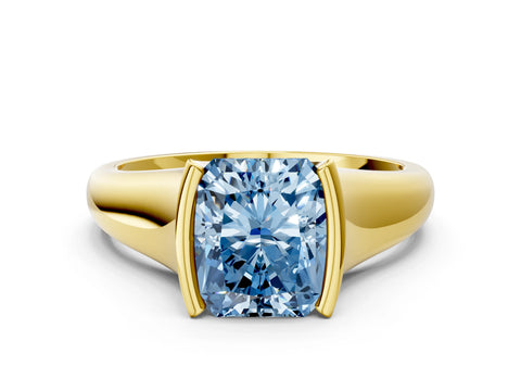Yellow gold Fancy Blue Radiant Cut Solitaire Tension Set Diamond Ring with Split Shank Band