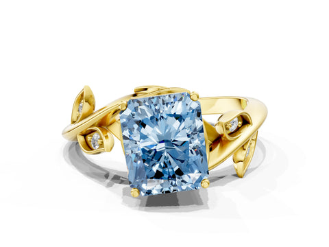 Yellow gold Fancy Blue Radiant Cut Solitaire Twist Engagement Ring with Leaf Accents and Prong Setting