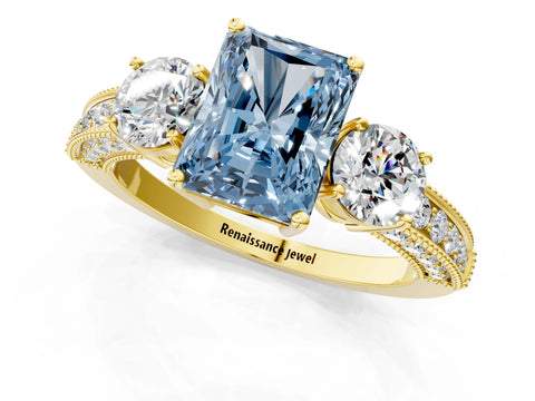 Yellow gold Fancy Blue Radiant Cut Three-Stone Diamond Ring with Pavé Band and Four-Prong Setting_1
