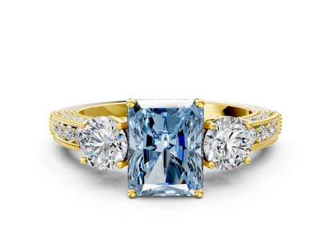 Yellow gold Fancy Blue Radiant Cut Three-Stone Diamond Ring with Pavé Band and Four-Prong Setting