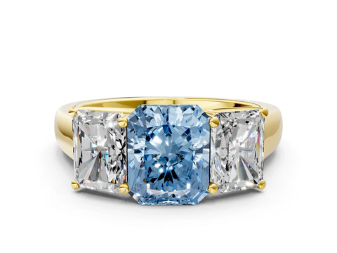 Yellow gold Fancy Blue Radiant Cut Three-Stone Diamond Ring with Prong Setting on a Classic Band